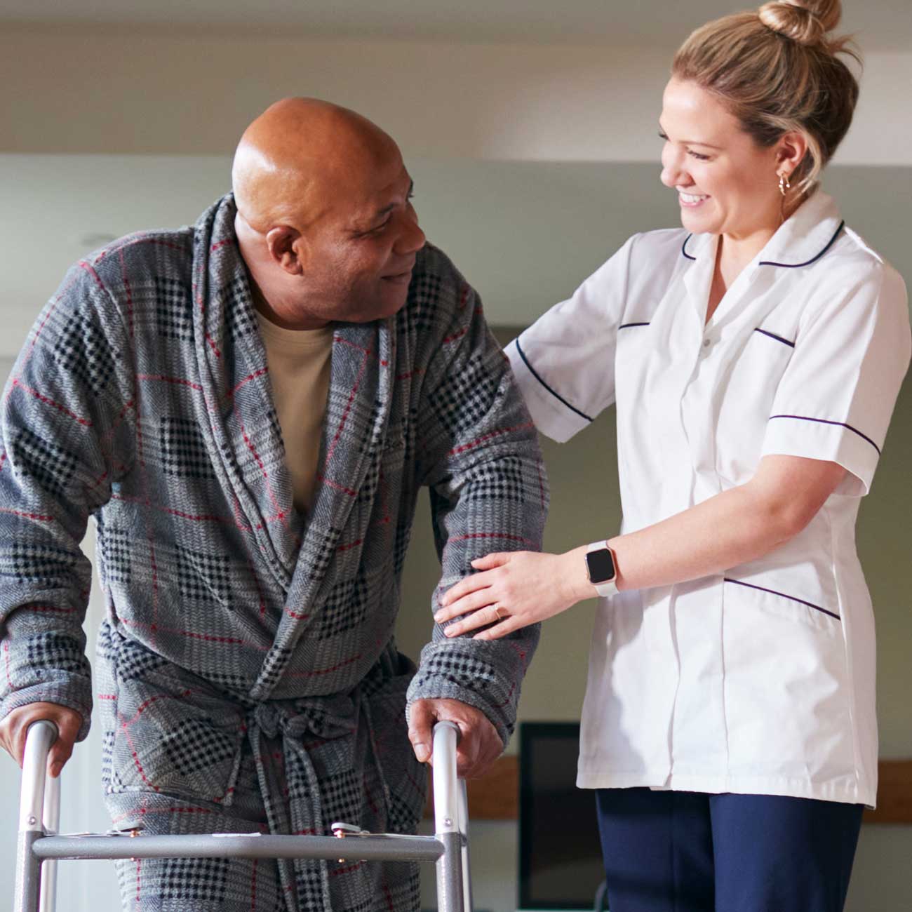 Home care aide assisting a client.